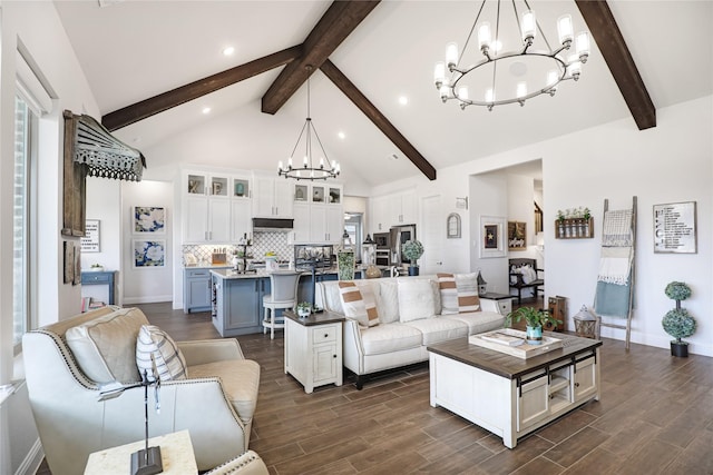 living room featuring a notable chandelier, dark wood-type flooring, high vaulted ceiling, and beamed ceiling