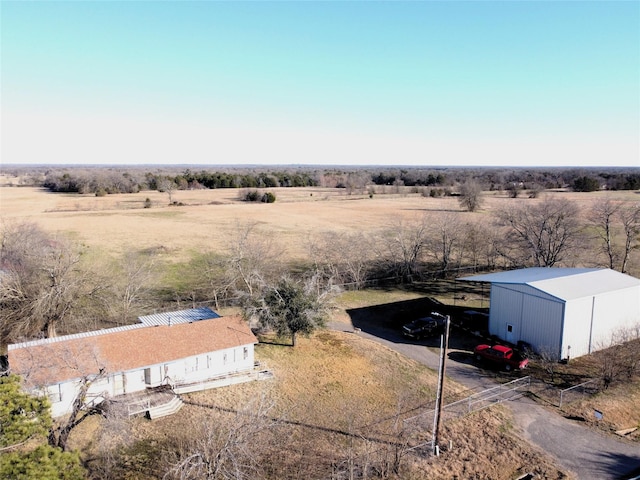 birds eye view of property with a rural view