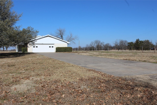 exterior space featuring a lawn and a garage