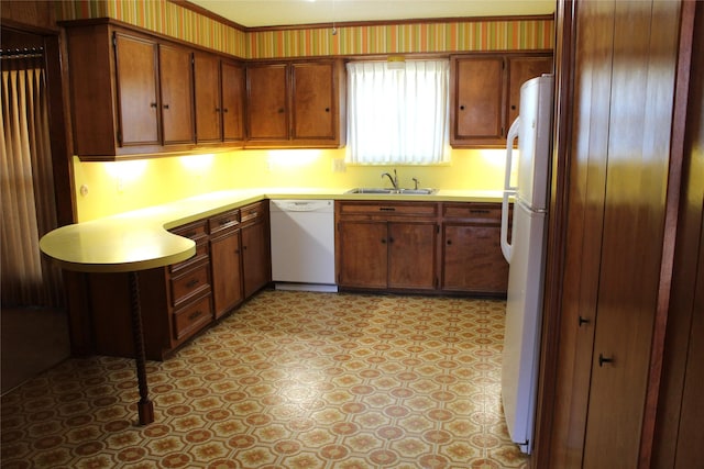 kitchen with sink and white appliances