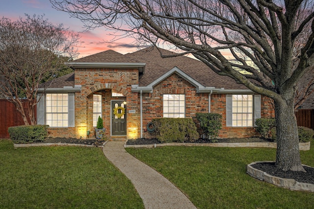 view of front of property with a yard