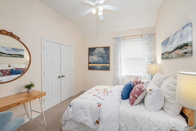 bedroom featuring ceiling fan, carpet, a closet, and lofted ceiling