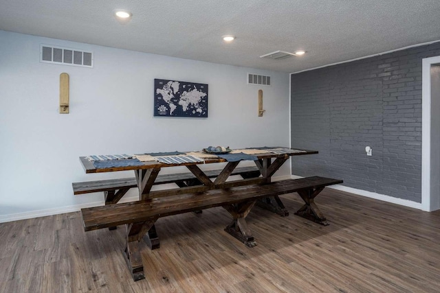 dining area with breakfast area and dark wood-type flooring