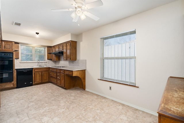 kitchen with black appliances, backsplash, ceiling fan, and sink