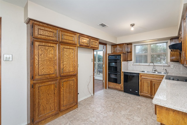 kitchen with sink, black appliances, decorative backsplash, and plenty of natural light