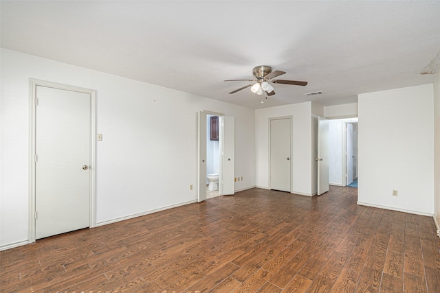 unfurnished room with ceiling fan and dark hardwood / wood-style flooring