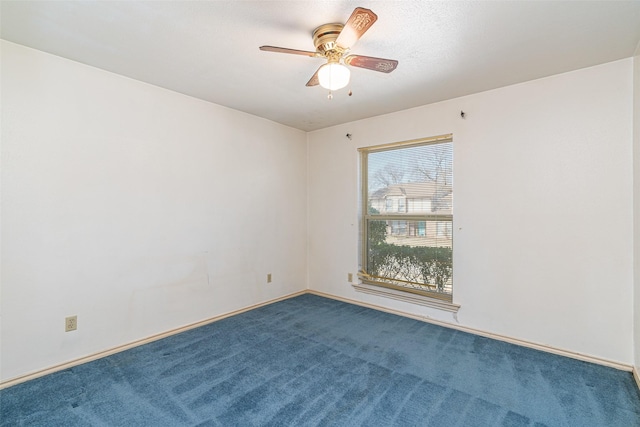 spare room featuring ceiling fan and carpet flooring