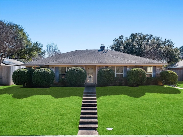 ranch-style house featuring a front lawn