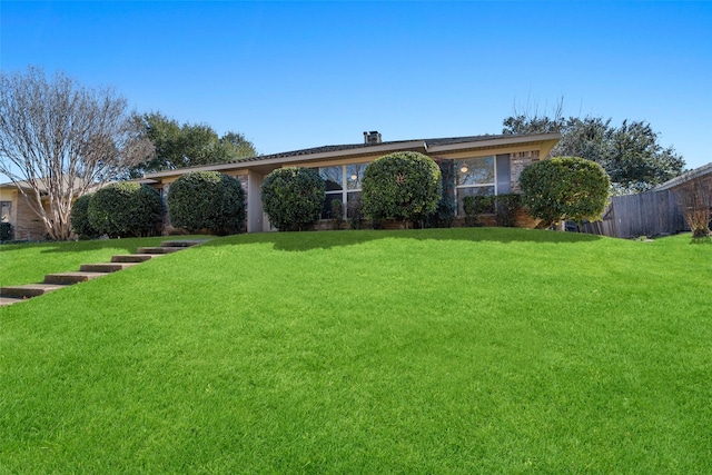 view of front of home with a front yard