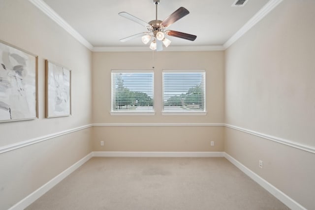 unfurnished room featuring light colored carpet, ceiling fan, and ornamental molding