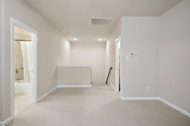 interior space featuring light colored carpet