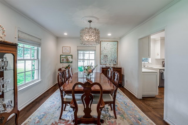 dining area with dark hardwood / wood-style flooring, a wealth of natural light, and ornamental molding