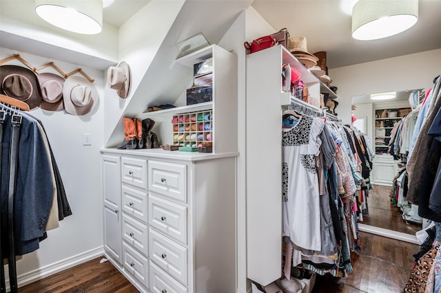 walk in closet featuring dark wood-type flooring