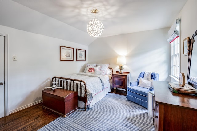 bedroom with dark hardwood / wood-style flooring and vaulted ceiling