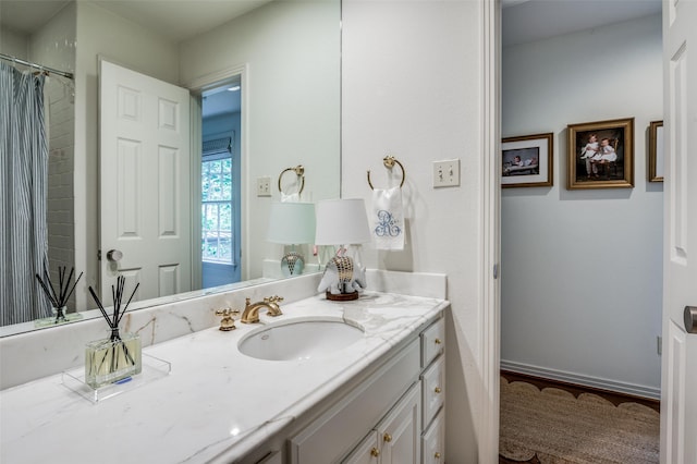 bathroom featuring vanity and hardwood / wood-style floors