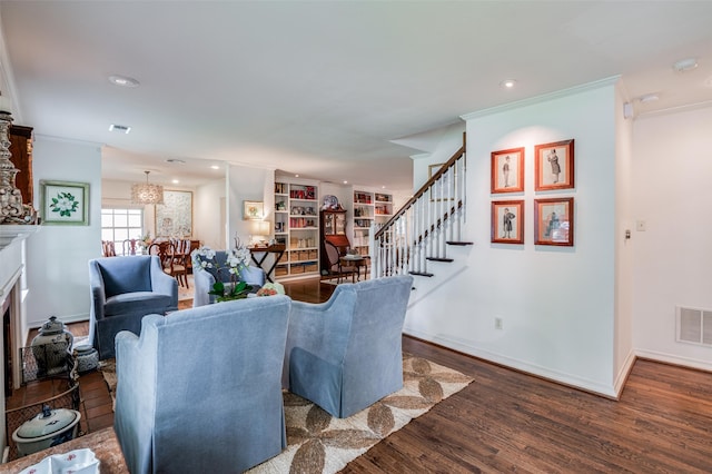 living room featuring crown molding and dark hardwood / wood-style floors