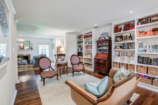 sitting room featuring crown molding and wood-type flooring