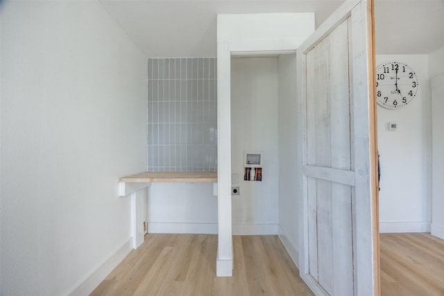 clothes washing area featuring hookup for an electric dryer, light hardwood / wood-style flooring, and hookup for a washing machine