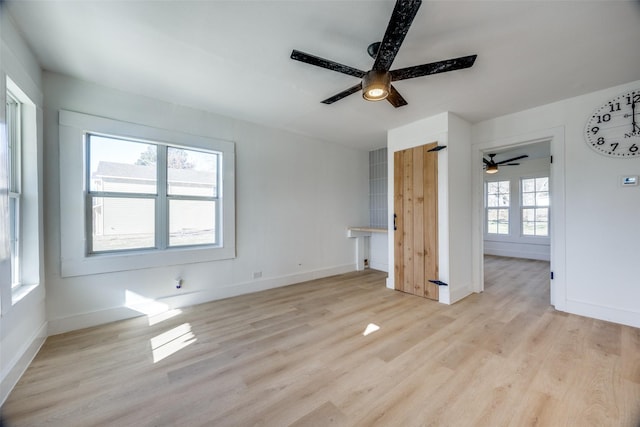 unfurnished room featuring ceiling fan and light hardwood / wood-style flooring