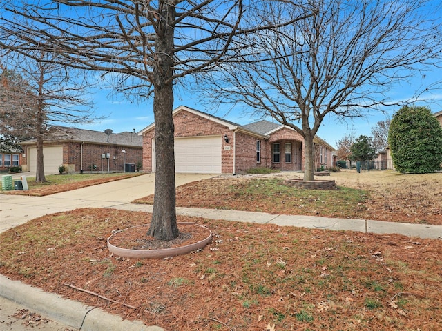 ranch-style home featuring brick siding, concrete driveway, and a garage