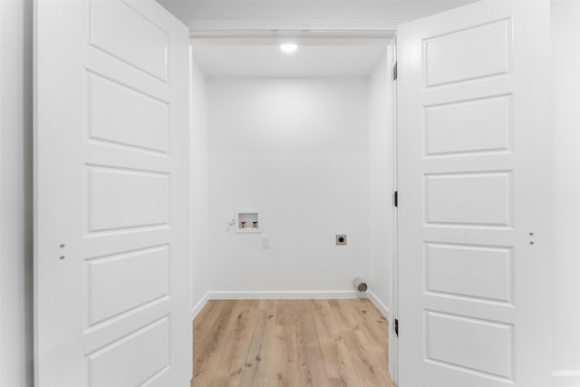 laundry room with laundry area, baseboards, hookup for a washing machine, hookup for an electric dryer, and light wood-type flooring