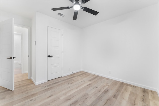 unfurnished room featuring ceiling fan and light wood-type flooring