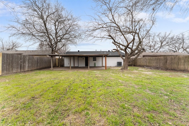 back of property featuring a patio area, a fenced backyard, a lawn, and central AC