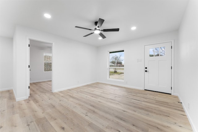 entrance foyer featuring ceiling fan and light hardwood / wood-style flooring