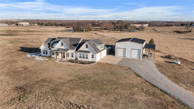 birds eye view of property featuring a rural view