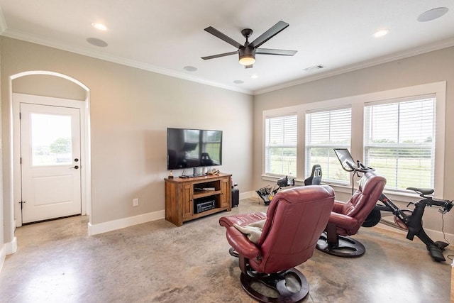 workout area with ceiling fan and ornamental molding