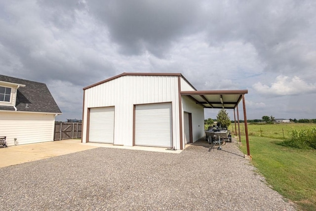 garage featuring a lawn