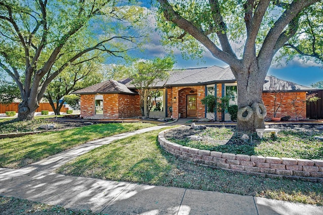 ranch-style house with a front lawn