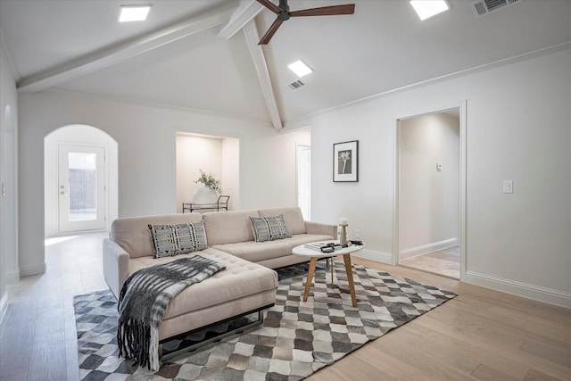 living room with vaulted ceiling with beams, light hardwood / wood-style flooring, and ceiling fan