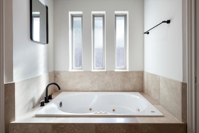 bathroom with tiled bath