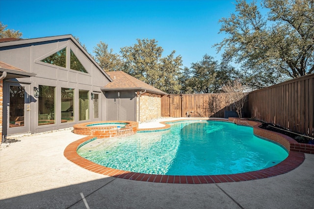 view of pool with an in ground hot tub and a patio