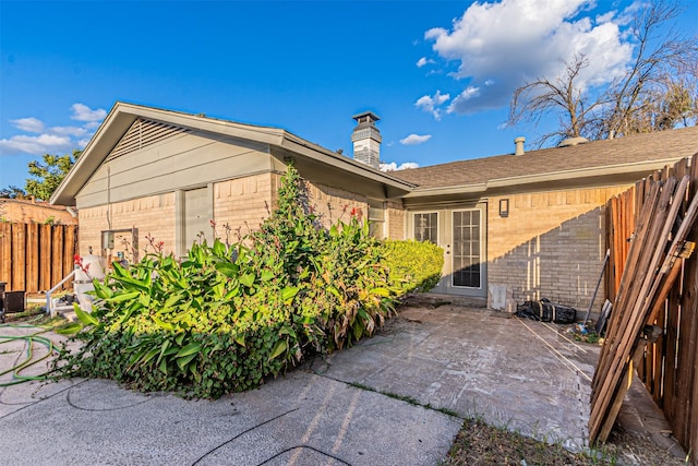 view of side of property with a patio