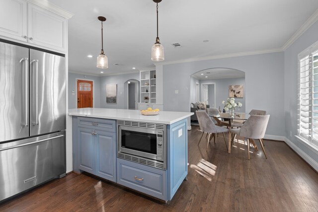 kitchen featuring appliances with stainless steel finishes, white cabinets, blue cabinets, kitchen peninsula, and ornamental molding