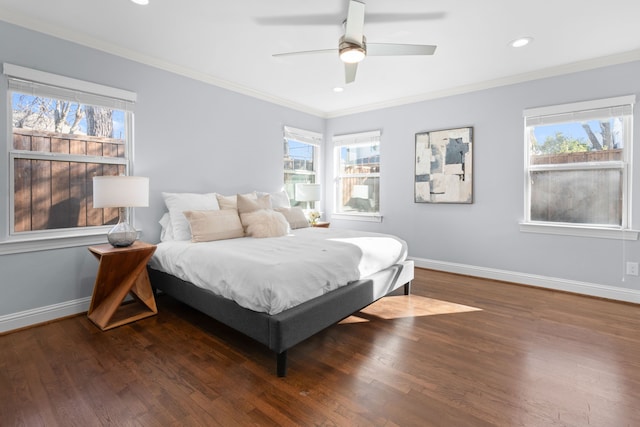 bedroom featuring ceiling fan, crown molding, and dark hardwood / wood-style flooring