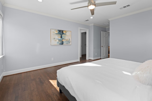 bedroom featuring ceiling fan, dark hardwood / wood-style floors, and crown molding