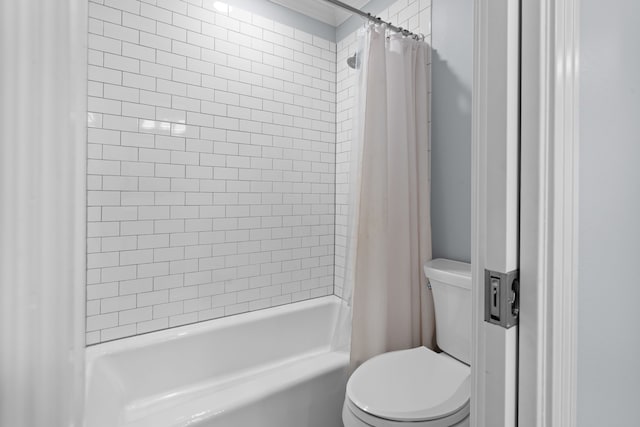 bathroom with toilet and shower / tub combo with curtain