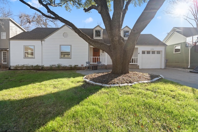 view of front of home featuring a garage and a front yard