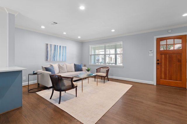 living room with crown molding and dark wood-type flooring