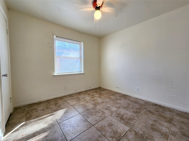 spare room with ceiling fan