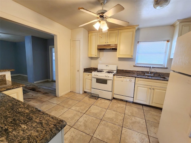 kitchen featuring sink, ceiling fan, white appliances, and cream cabinetry