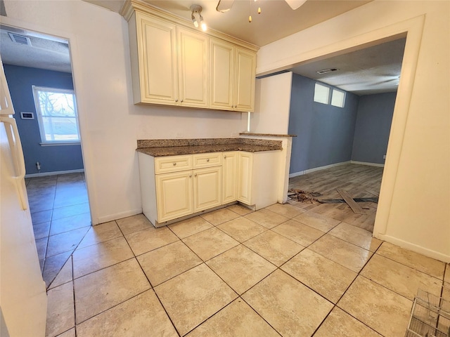 kitchen with ceiling fan and light tile patterned floors