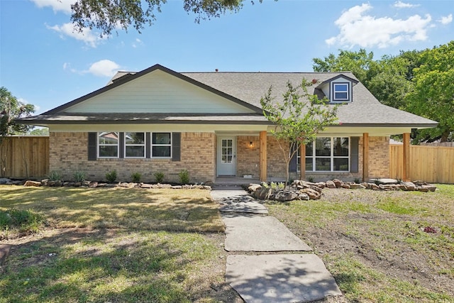 view of front of property with a porch and a front lawn