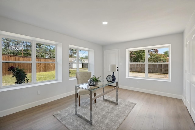 office space with light hardwood / wood-style floors