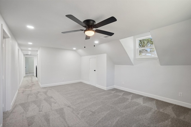 bonus room featuring light carpet, vaulted ceiling, and ceiling fan