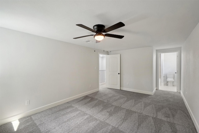 unfurnished bedroom featuring carpet, connected bathroom, and ceiling fan