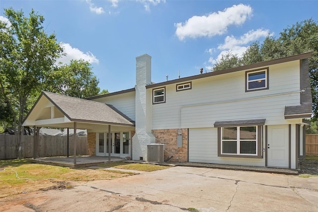 back of property with a patio and central air condition unit